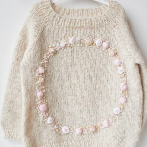 Baby knitted clothes. handmade knitted clothes with embroidery