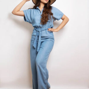 Latina girl dressed in jean jumpsuit and hat
